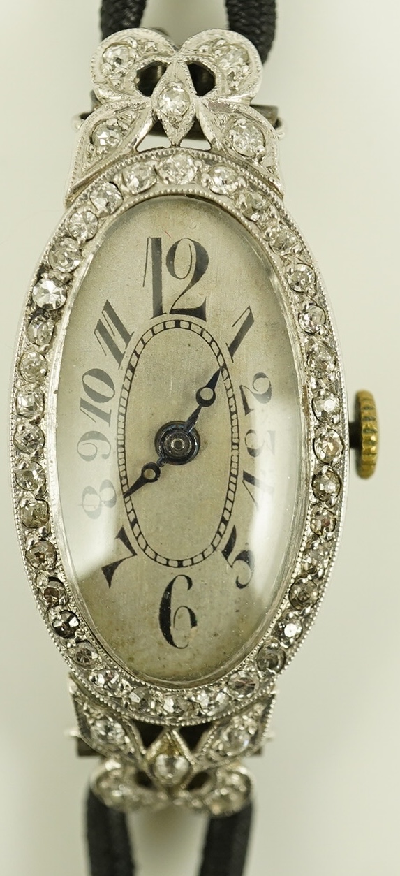 A lady's 1920's/1930's platinum and diamond cluster set cocktail watch